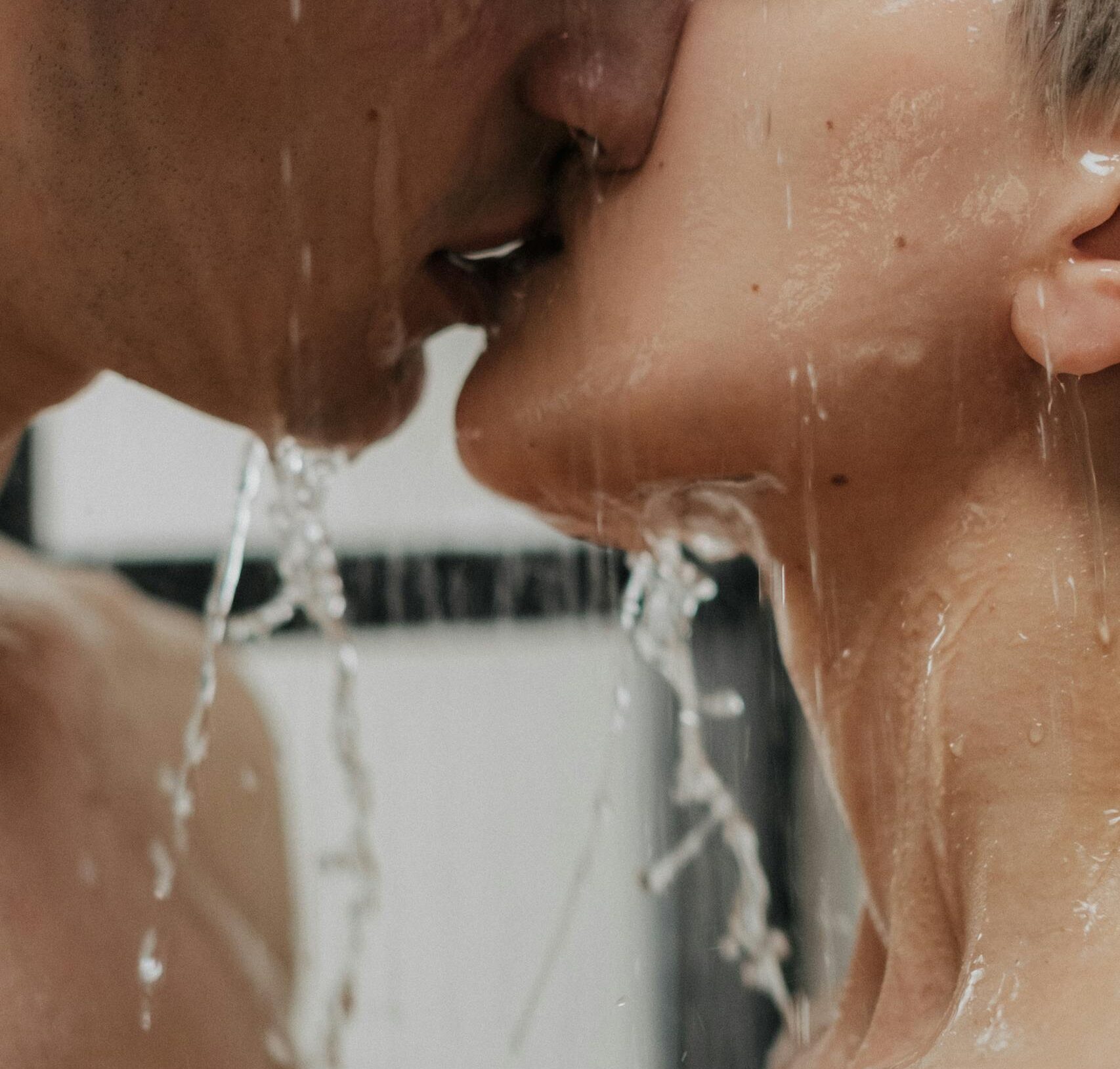 Couple Passionately Kissing in the Shower