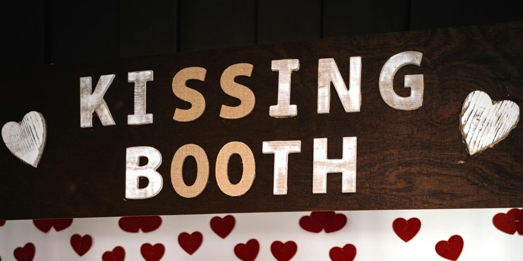 Woman Standing on the Kissing Booth